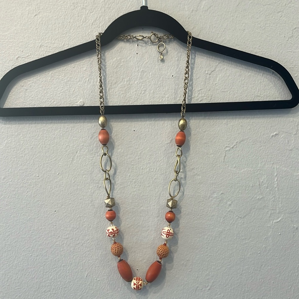 Gold necklace with orange beads